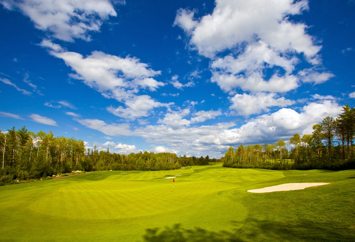 Golfers playing at The Wilderness course at Fortune Bay Resort Casino in Tower Minnesota near Lake Vermilion